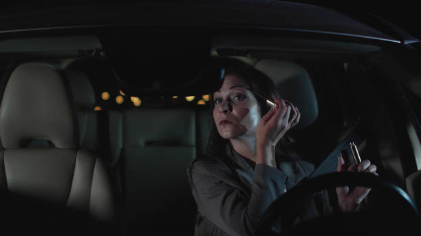 istock Pretty woman sit in car at night 1178083789