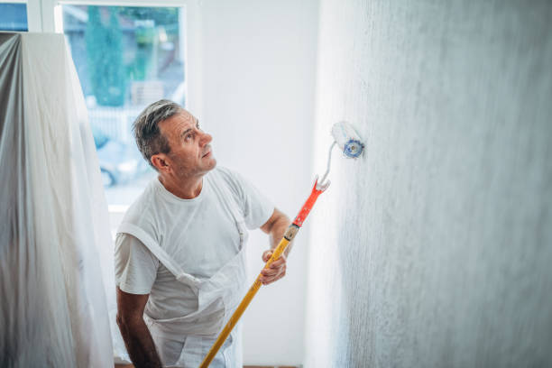 istock Man painting home walls alone 1178084233