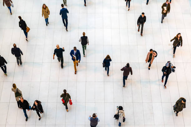 Top view people walking white floor or large crowd of anonymous people. Top view people walking white floor or large crowd of anonymous people. population explosion photos stock pictures, royalty-free photos & images