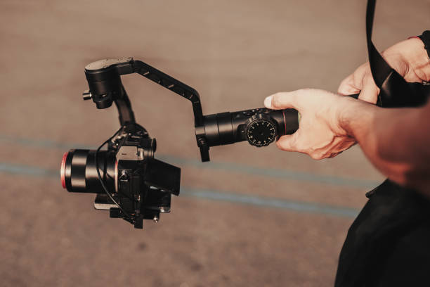 istock Professional record. Videography. Hand with cinematic digital equipment. Record device. Camera stabilizer 1178085564