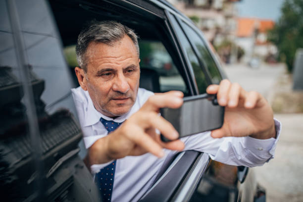 istock Man taking photos from the car 1178085714