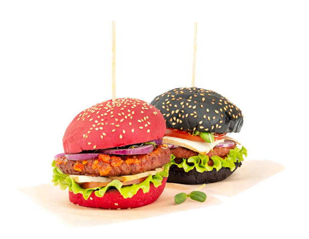 Two healthy vegan burgers on a paper isolated on white background stock photo