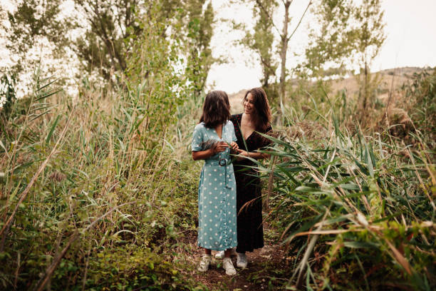 istock Two young women embraced on the field 1178087111