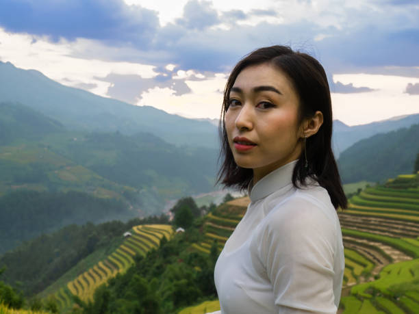 istock Women in white ao dai 1178087456