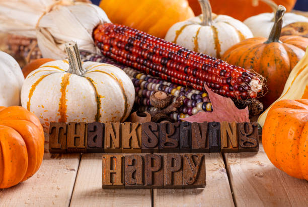 istock Happy Thanksgiving Text With Pumpkins and Corn 1178089145