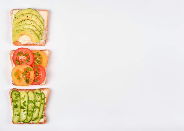 istock Set with toast bread and different toppings on white background, top view 1178095601