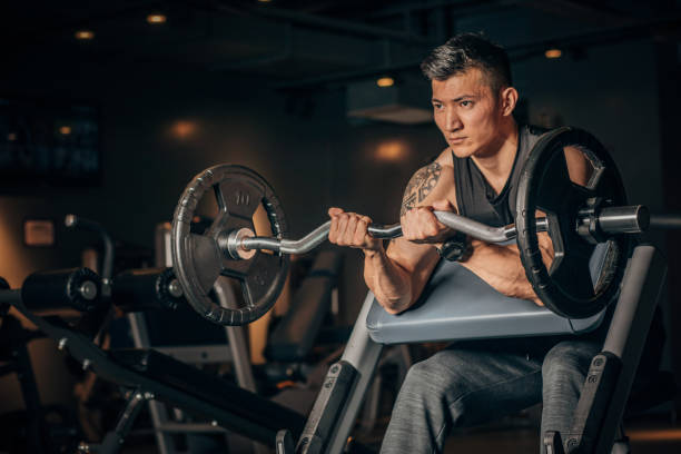 istock Fit Chinese man practicing in dark gym 1178097582