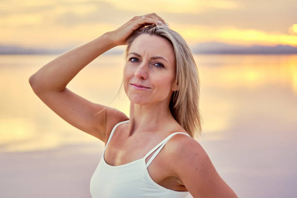 istock Middle-aged sportive woman posing during sunset on nature 1178099172