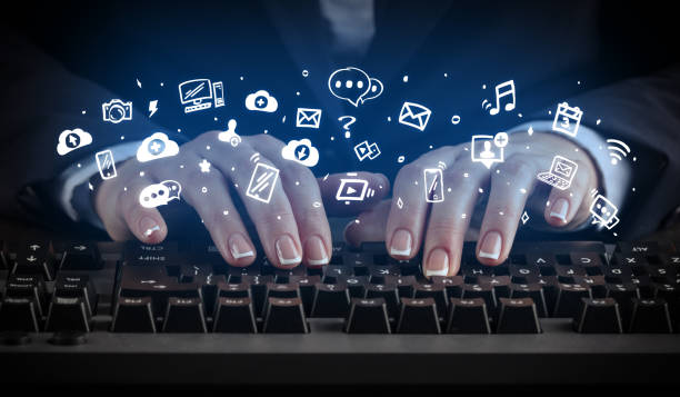 istock Woman typing on keyboard with application icons around 1178101127