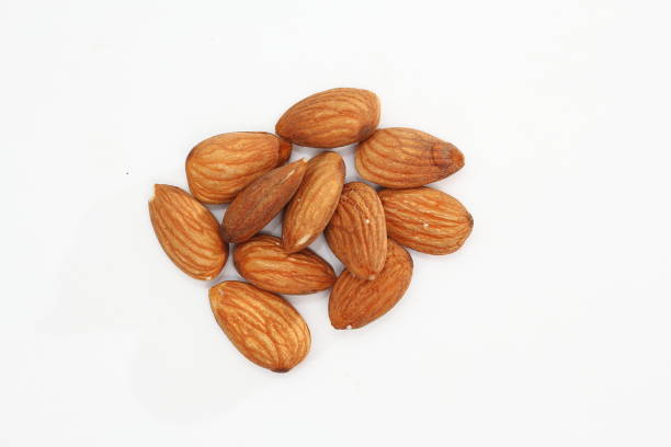 istock Whole raw almonds isolated on white background. 1178101950