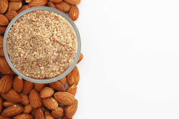 istock Raw almonds on left side of a white background. 1178101977