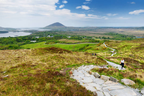 Connemara National Park, famous for bogs and heaths, watched over by its cone-shaped mountain, Diamond Hill, County Galway, Ireland Beautiful view of Connemara National Park, famous for bogs and heaths, watched over by its cone-shaped mountain, Diamond Hill, County Galway, Ireland connemara national park stock pictures, royalty-free photos & images