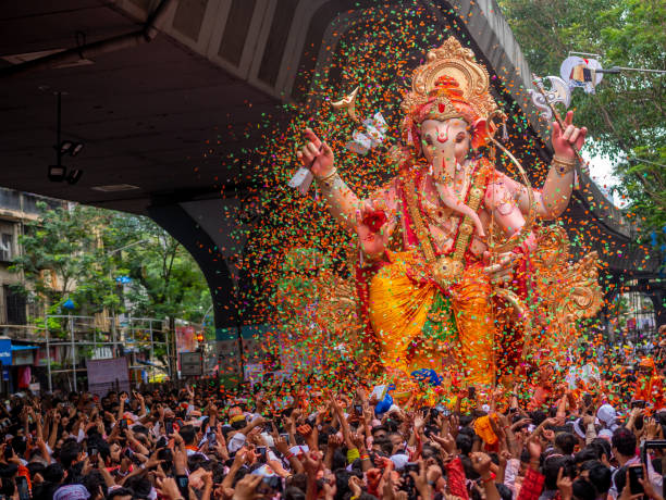 Ganesh Festival Mumbai, India - September 12,2019 : Thousands of devotees bid adieu to tallest Lord Ganesha with colors in Mumbai during Ganesh Visarjan which marks the end of the ten-day-long Ganesh Chaturthi festival. raja stock pictures, royalty-free photos & images