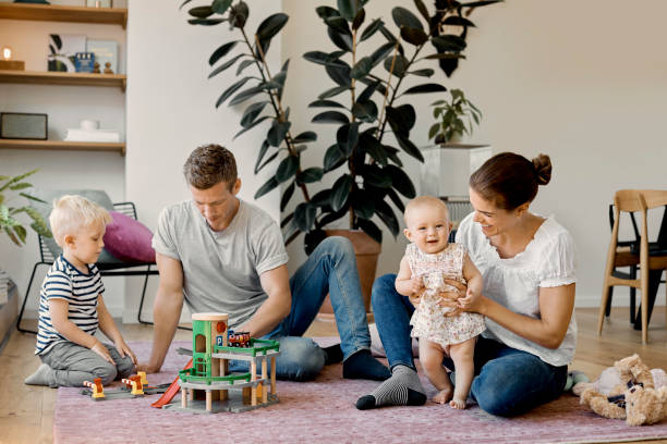 istock Parents enjoying weekend with kids on carpet 1178112302