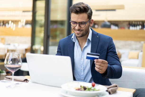 istock Businessman dining in restaurant and using credit card 1178115023