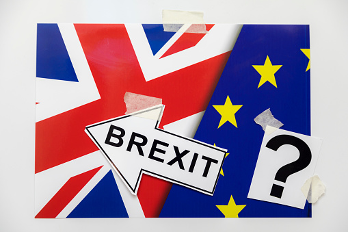 Brexit One Big Question Mark, British And European Union Flag Pair, Brexit Arrow sign and Question Mark as Concept Ideas. UK leaving EU