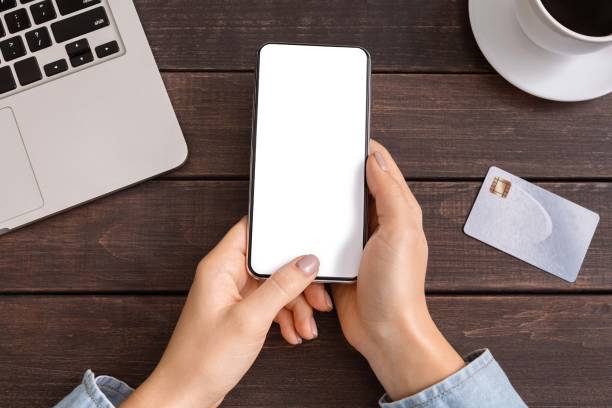istock Woman's hands holding using cell phone with credit card 1178120968