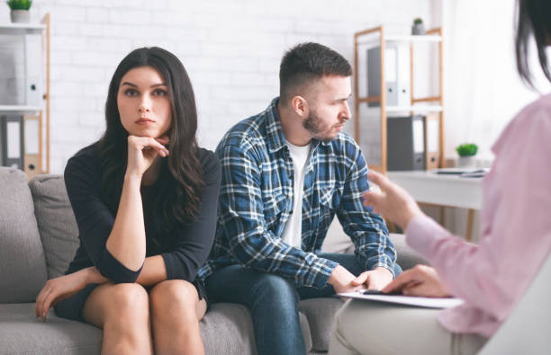 istock Grumpy couple at marital therapist in office, free space 1178121163