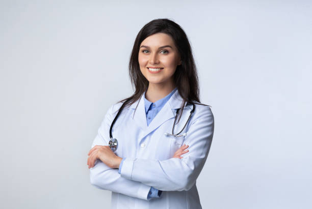 istock Cheerful doctor standing crossing hands in studio 1178123108