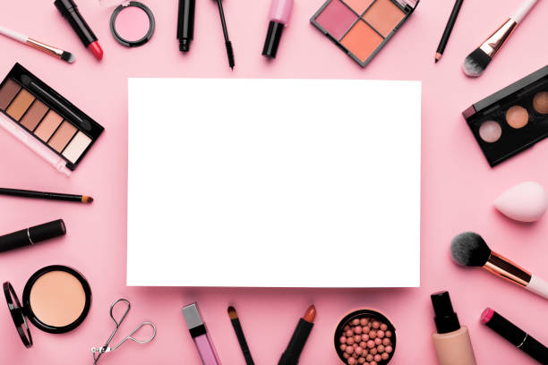 istock White blank sheet of paper surrounded by luxury decorative cosmetics 1178123196