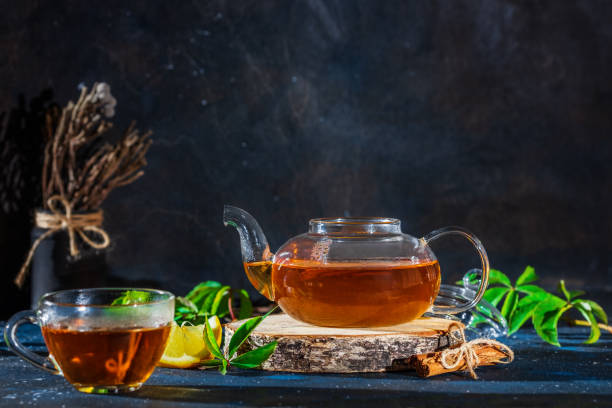 istock Tea cup with hot tea and tea pot. Place for text . 1178123566