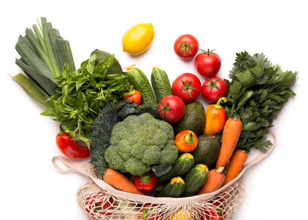 istock Fresh vegetables from farm inside eco bag on white 1178124739