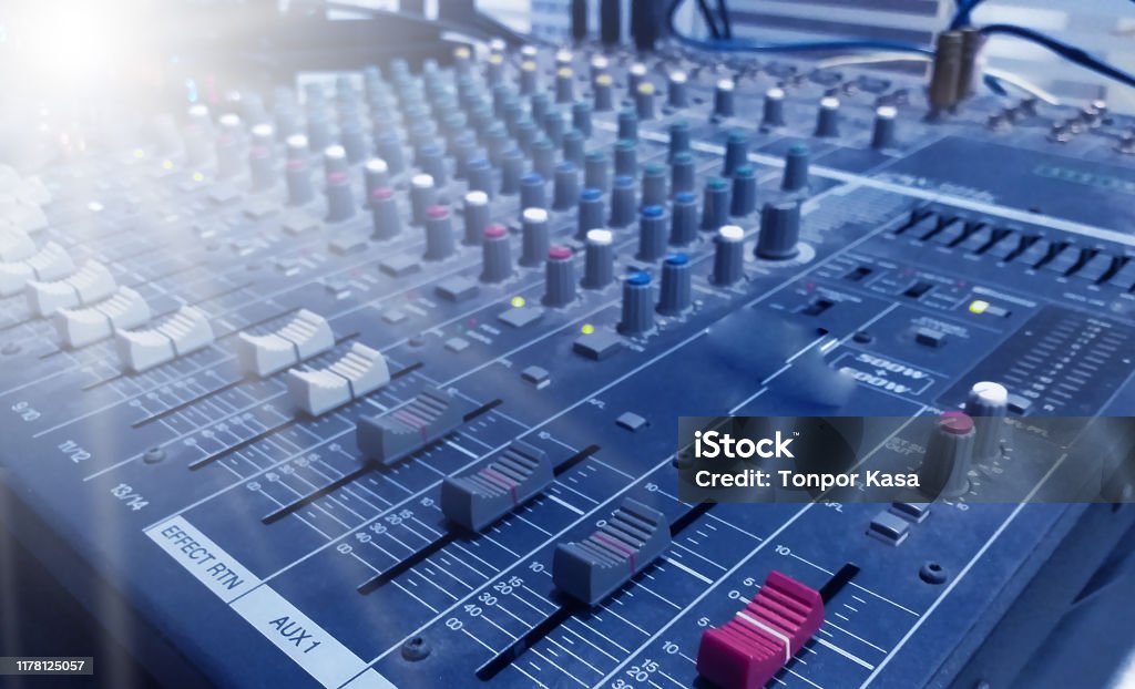 Professional audio Mixer and Professional Headphones in the Recording Studio. Sound Mixing Desk. Sound Mastering For Radio and TV Broadcast. Professional audio Mixer and Professional Headphones in the Recording Studio. Sound Mixing Desk. Balance Stock Photo