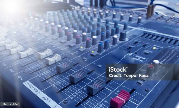 Professional Audio Mixer And Professional Headphones In The Recording Studio Sound Mixing Desk Sound Mastering For Radio And Tv Broadcast Stock Photo - Download Image Now
