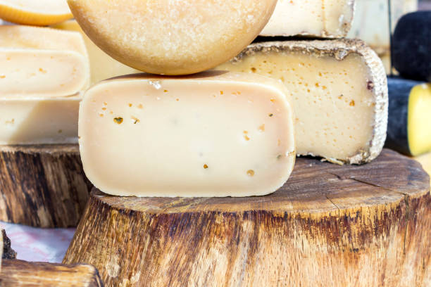 istock Different types of tasty cheeses on a wooden table. 1178126035