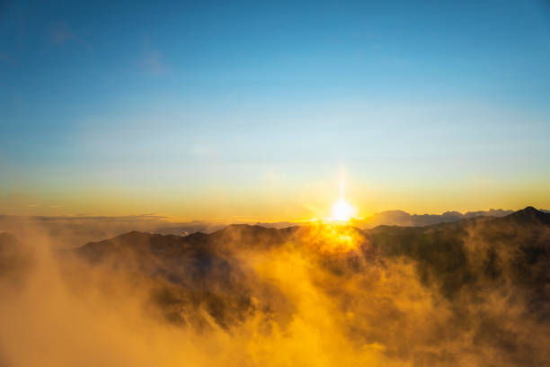 real big sun over mountains horizon - equinoccio de otoño fotografías e imágenes de stock