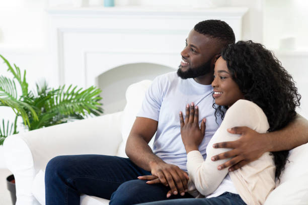 istock Young couple sitting at home and thinking about future together 1178127294