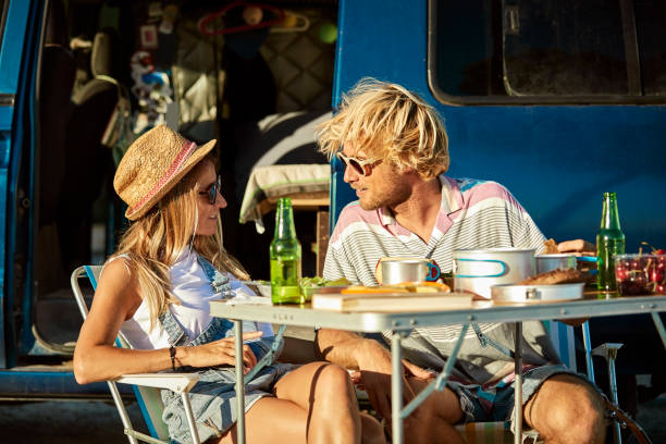 istock Mid adult couple talking at table against van 1178129807