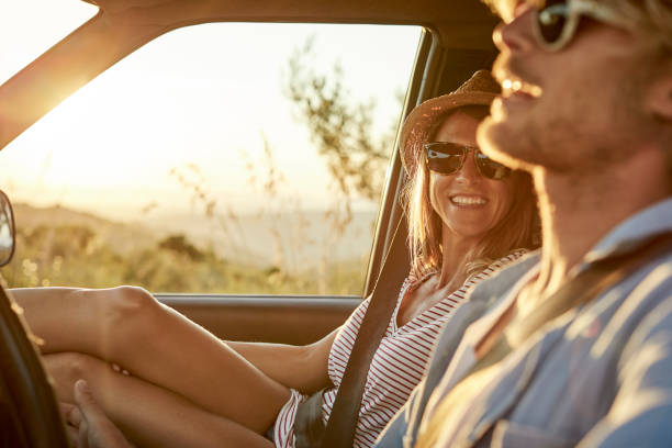 istock Happy woman looking at man driving van 1178129939