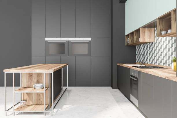 istock Side view of gray and blue kitchen with island 1178130404
