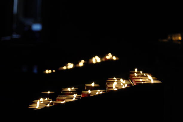 istock votive candles lit in a church 1178133463