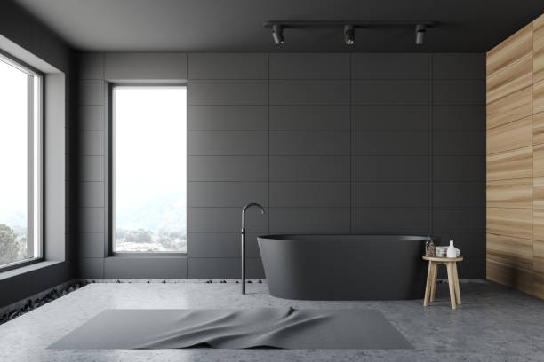 istock Gray tile and wood loft bathroom interior 1178135000