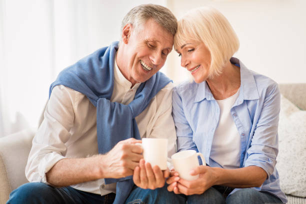 istock Tender mature couple drinking tea at autumn day 1178135499