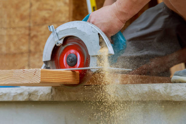 istock Building contractor worker using hand held worm drive circular saw to cut boards on a new home constructiion project 1178136302