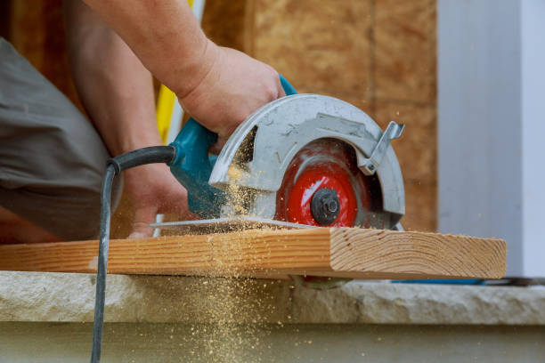 Circular Saw. Carpenter Using Circular Saw for wood beam