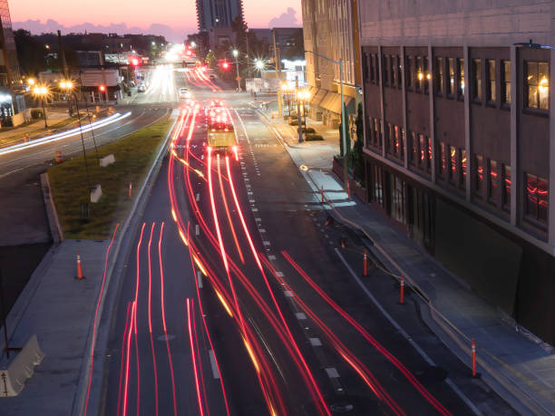 istock Traffic rushing into a city during the early morning rush hours with light streakes . 1178136454