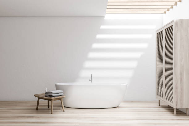 istock White bathroom with tub and wardrobe 1178137825