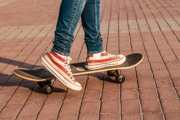 istock Skateboarder legs riding skateboard at street 1178137877