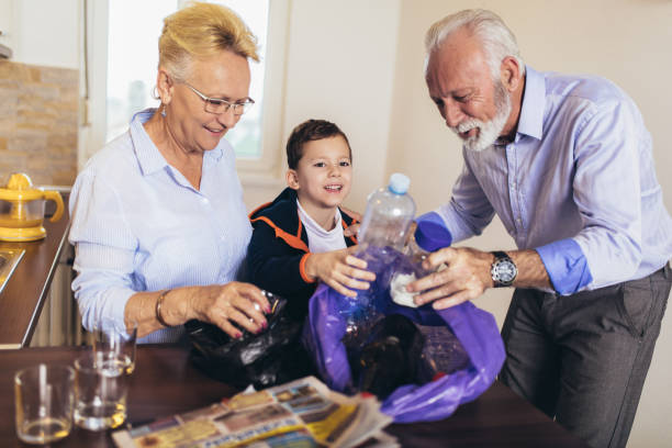 istock Family having fun while segregating waste at home 1178139698