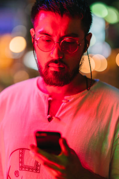 istock Portrait of young man at night 1178140481