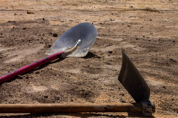 istock Hoe and shovel in the sand 1178147012