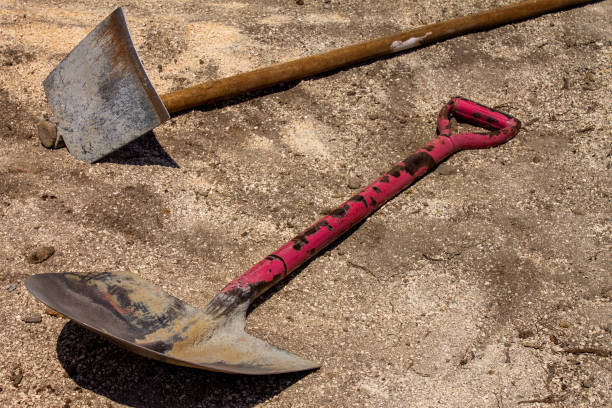 istock Hoe and shovel in the sand 1178147024