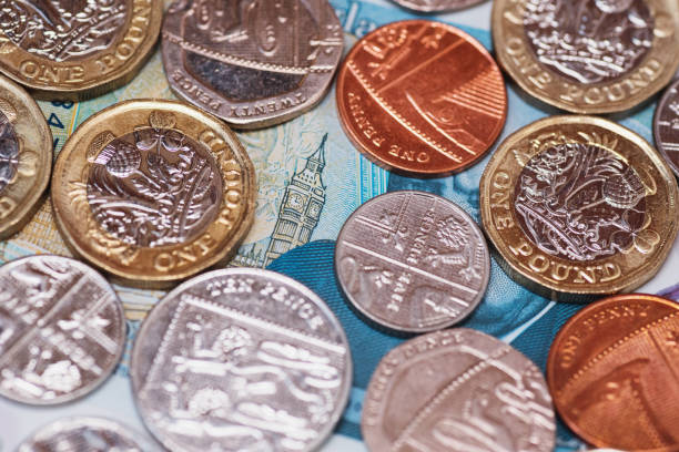istock Great Britain Pound (GBP) coins and Big Ben from a 5 GBP banknote 1178148849