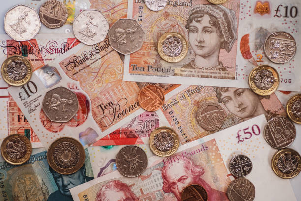 istock Great Britain Pound (GBP) coins and banknotes 1178149922