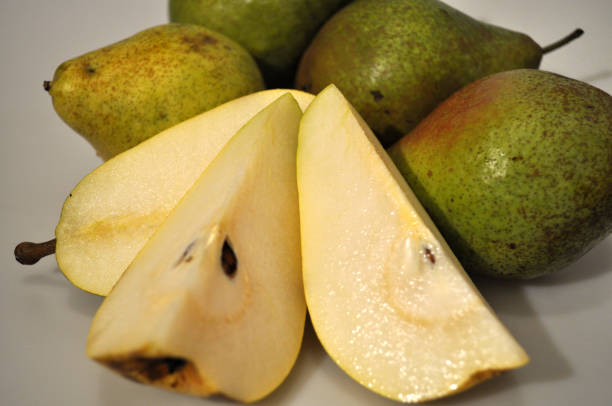 istock Fresh ripe pear on a white background. Large green pear 1178151690