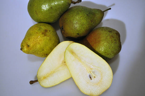 istock Fresh ripe pear on a white background. Large green pear 1178151696